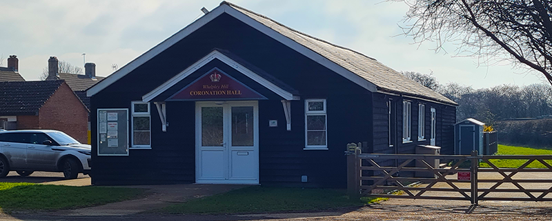 Coronation Hall in hazy sunshine